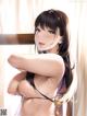 Anime girl with long black hair posing naked in front of a window.