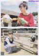 A woman feeding a goat a carrot in a pen.